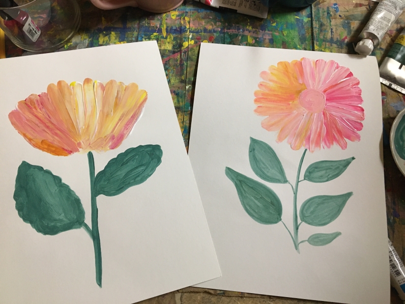 mix up pinks and oranges and paint a flower with your finger.