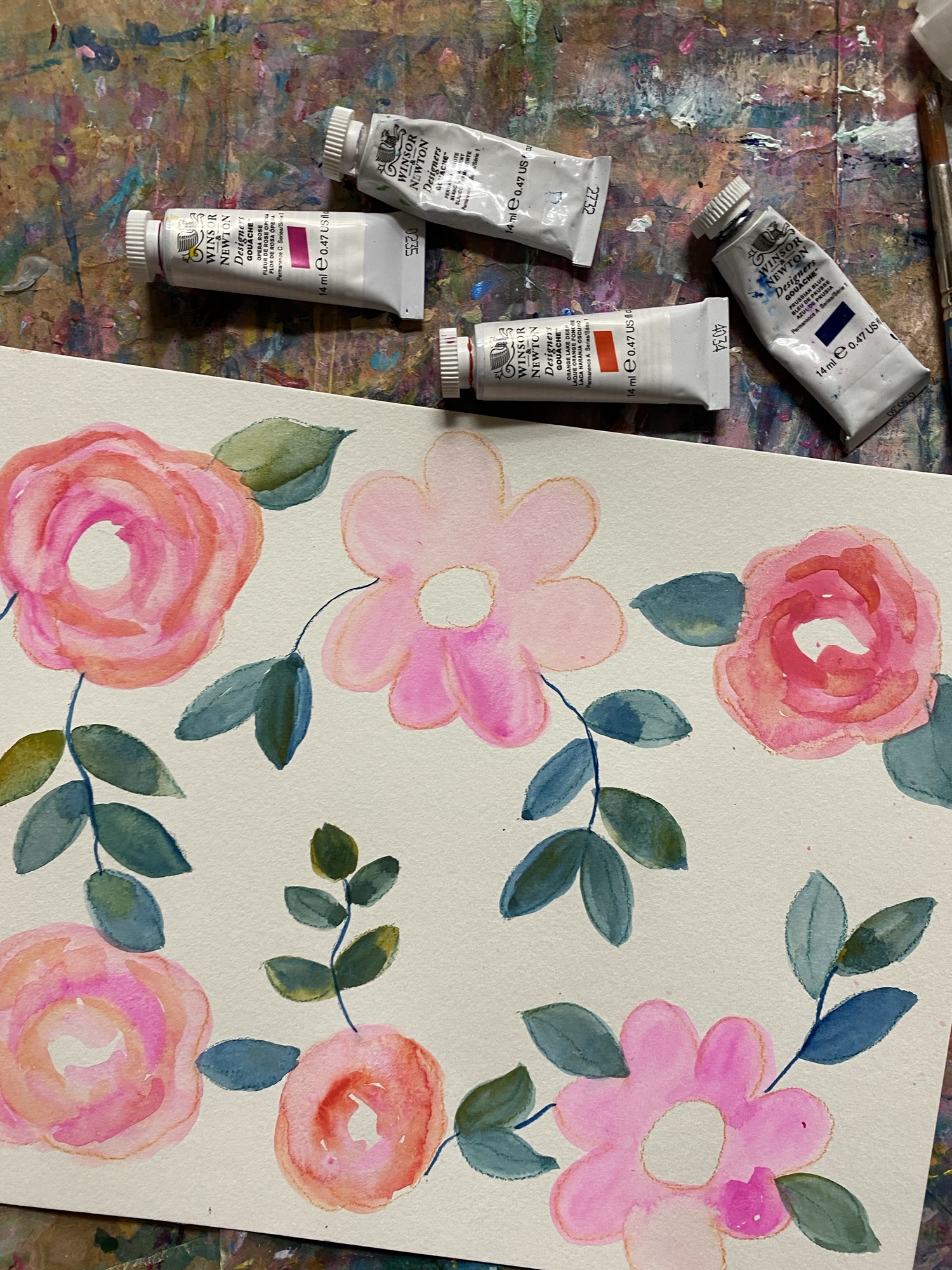 six flowers painted with pink and orange gouache